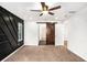 Bedroom boasts a sliding barn door that leads to a large walk in closet and a designer accent wall at 3444 Underwood Se Ct, Conyers, GA 30013