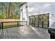 A dark deck offers plenty of room to entertain, and has a large sliding glass door at 3444 Underwood Se Ct, Conyers, GA 30013