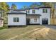Inviting modern home with a black roof, white siding, and manicured lawn at 3444 Underwood Se Ct, Conyers, GA 30013