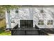 White exterior featuring a spacious dark deck perfect for outdoor entertaining and relaxation at 3444 Underwood Se Ct, Conyers, GA 30013