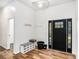 Welcoming foyer with hardwood floors, a modern door, and storage at 3444 Underwood Se Ct, Conyers, GA 30013