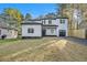 Inviting two-story white home with neat landscaping, a covered porch, and an attached garage at 3444 Underwood Se Ct, Conyers, GA 30013