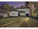Inviting two-story white home with neat landscaping, a covered porch, and an attached garage at 3444 Underwood Se Ct, Conyers, GA 30013