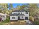 Inviting two-story white home with neat landscaping, a covered porch, and an attached garage at 3444 Underwood Se Ct, Conyers, GA 30013