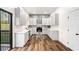 Modern kitchen with white cabinets, stainless steel appliances, and a stylish backsplash at 3444 Underwood Se Ct, Conyers, GA 30013