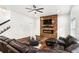 Elegant living room with a fireplace and a comfortable, oversized sofa at 3444 Underwood Se Ct, Conyers, GA 30013