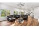 Open living room featuring a comfortable sofa and hardwood floors at 3444 Underwood Se Ct, Conyers, GA 30013