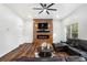 Cozy living room with a fireplace, mounted TV, and comfortable seating at 3444 Underwood Se Ct, Conyers, GA 30013