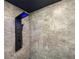 Modern shower featuring unique stone-look tile walls and a multi-setting shower panel at 3444 Underwood Se Ct, Conyers, GA 30013