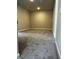 Spacious carpeted bonus room with neutral paint and recessed lighting awaits your personal touch at 4180 Cavalier Way, Duluth, GA 30097