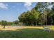 View of the dog park with a splash pad and trees in the background at 4180 Cavalier Way, Duluth, GA 30097
