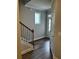 Inviting entryway boasts hardwood floors, neutral paint, and natural light from the front door window at 4180 Cavalier Way, Duluth, GA 30097