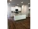Modern kitchen with white cabinets, granite countertops, and stainless steel appliances at 4180 Cavalier Way, Duluth, GA 30097
