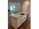 Kitchen island with granite countertop, stainless sink, and ample storage at 4180 Cavalier Way, Duluth, GA 30097