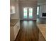 Open-concept kitchen and dining area with granite countertops and stainless steel appliances at 4180 Cavalier Way, Duluth, GA 30097