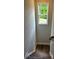Upstairs stairwell features hardwood flooring and a window with a picturesque green view at 4180 Cavalier Way, Duluth, GA 30097
