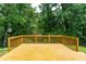 Spacious wooden deck surrounded by trees, perfect for outdoor entertaining and relaxing at 4613 Creek Forest Ct, Lilburn, GA 30047