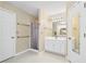 Large bathroom featuring shower and vanity at 4613 Creek Forest Ct, Lilburn, GA 30047