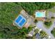 Community featuring a swimming pool, tennis and basketball courts surrounded by mature trees at 4613 Creek Forest Ct, Lilburn, GA 30047