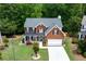 Charming two-story brick home with a well-manicured lawn and inviting curb appeal at 4613 Creek Forest Ct, Lilburn, GA 30047