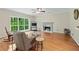 Inviting living room with a fireplace, hardwood flooring, and ample natural light at 4613 Creek Forest Ct, Lilburn, GA 30047