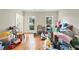 Spacious living room with hardwood floors and large windows offering lots of natural light at 4613 Creek Forest Ct, Lilburn, GA 30047