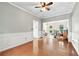 Spacious living room with hardwood floors, crown molding, and abundant natural light at 4613 Creek Forest Ct, Lilburn, GA 30047