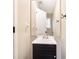 Modern bathroom with a sleek vanity, mirror, and fixtures at 5427 Highway 81, Loganville, GA 30052
