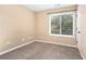 Bedroom featuring carpet and a window with blinds at 5427 Highway 81, Loganville, GA 30052