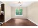 Dining room featuring hardwood floors, a large window, and neutral wall color at 5427 Highway 81, Loganville, GA 30052