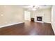 Spacious living room featuring hardwood floors, a fireplace, and neutral wall color at 5427 Highway 81, Loganville, GA 30052