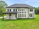 Beautiful backyard with a covered patio and lush green lawn at 2339 Eastwood Dr, Snellville, GA 30078