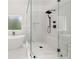 Bathroom features glass shower with bench, rain shower head, and a soaking tub at 2339 Eastwood Dr, Snellville, GA 30078