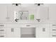 Bathroom features a double vanity with marble countertops and black hardware at 2339 Eastwood Dr, Snellville, GA 30078