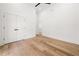 Bright bedroom with light hardwood floors, vaulted ceiling, and neutral paint at 2339 Eastwood Dr, Snellville, GA 30078