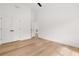 Bright bedroom with light hardwood floors, vaulted ceiling, and neutral paint at 2339 Eastwood Dr, Snellville, GA 30078