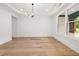 Dining room with hardwood floors, chandelier, and large window at 2339 Eastwood Dr, Snellville, GA 30078