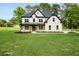 Beautiful two-story home with a manicured lawn and tasteful landscaping at 2339 Eastwood Dr, Snellville, GA 30078