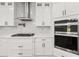 Gourmet kitchen with stainless steel appliances and hood at 2339 Eastwood Dr, Snellville, GA 30078