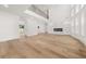 Bright living room with soaring ceilings, fireplace, and hardwood floors at 2339 Eastwood Dr, Snellville, GA 30078