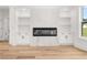 Contemporary living room with a modern fireplace and built-in shelving at 2339 Eastwood Dr, Snellville, GA 30078