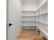 Walk-in pantry with custom shelving at 2339 Eastwood Dr, Snellville, GA 30078