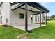 Covered patio with ceiling fan in a spacious backyard with great view at 2339 Eastwood Dr, Snellville, GA 30078