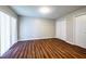 Bedroom with wood flooring, natural light, and closet space at 3626 Buford Ne Hwy # C2, Brookhaven, GA 30329