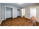 Bedroom with wood floors, open closets, and ensuite bathroom at 3626 Buford Ne Hwy # C2, Brookhaven, GA 30329