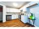 An updated kitchen featuring white cabinets, stainless steel appliances, and granite countertops at 3626 Buford Ne Hwy # C2, Brookhaven, GA 30329