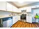 An updated kitchen featuring white cabinets, stainless steel appliances, and granite countertops at 3626 Buford Ne Hwy # C2, Brookhaven, GA 30329