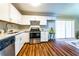 Bright kitchen with white cabinets, stainless steel appliances, and modern flooring, with sliding glass doors in the background at 3626 Buford Ne Hwy # C2, Brookhaven, GA 30329