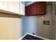 An unfinished laundry area with upper cabinets and utility hookups at 3626 Buford Ne Hwy # C2, Brookhaven, GA 30329