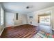 Inviting living area featuring wood-look floors, neutral walls, and an open layout leading to outdoor patio at 3626 Buford Ne Hwy # C2, Brookhaven, GA 30329